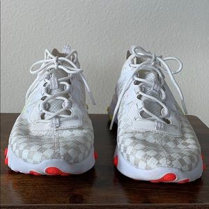 White Nike react with neon yellow and orange.